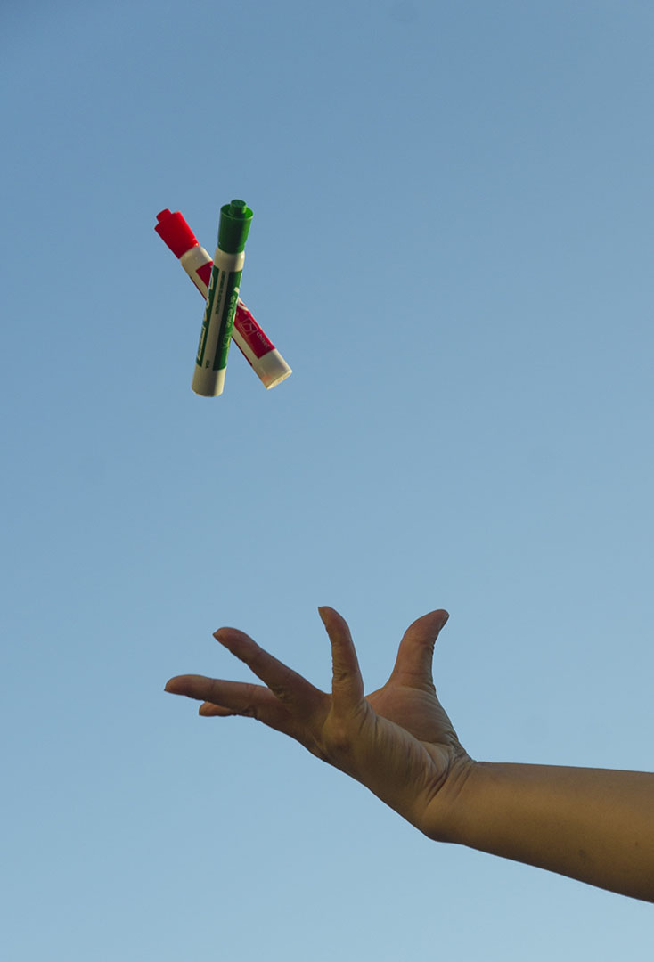 an example image (two markers being thrown up into the air), showing vibrant colors